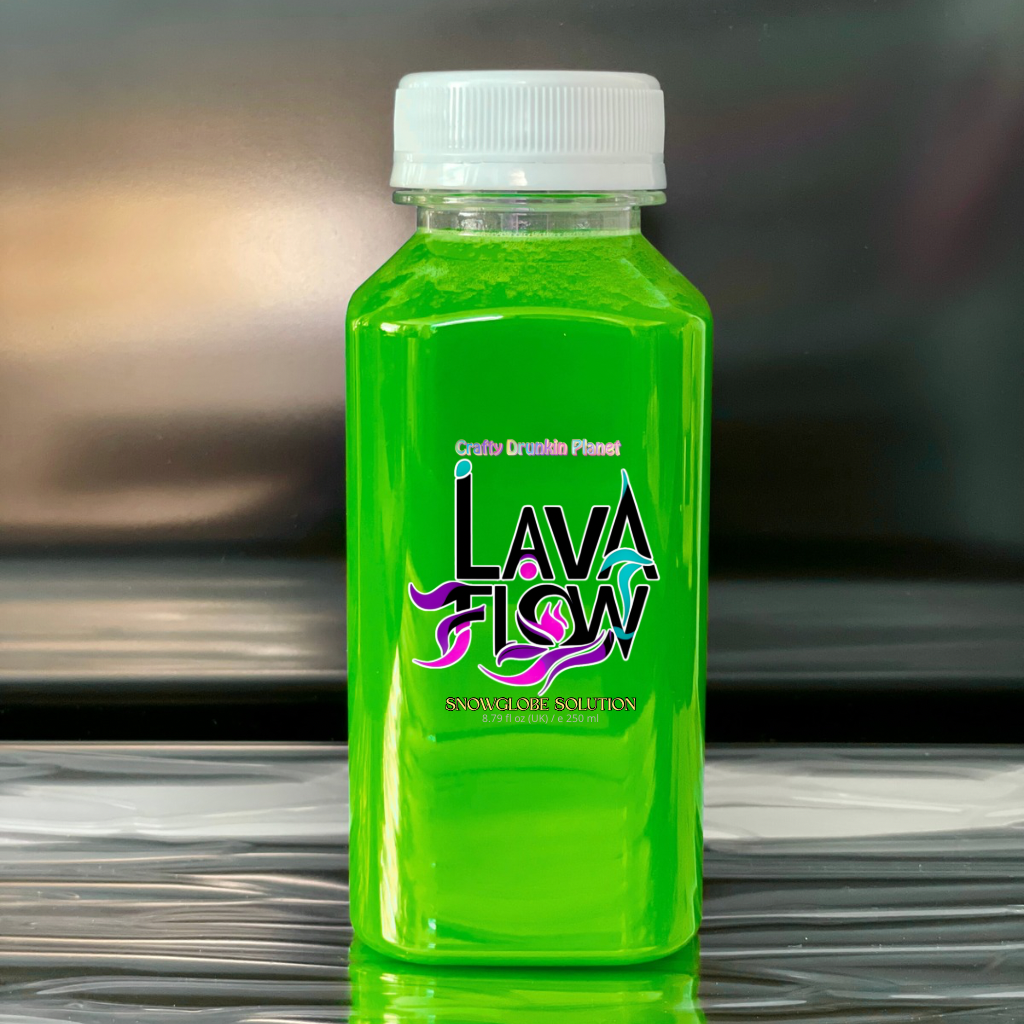Green bottle labeled 'Lava Flow' solution for snowglobetumbler on a reflective surface with a blurred background