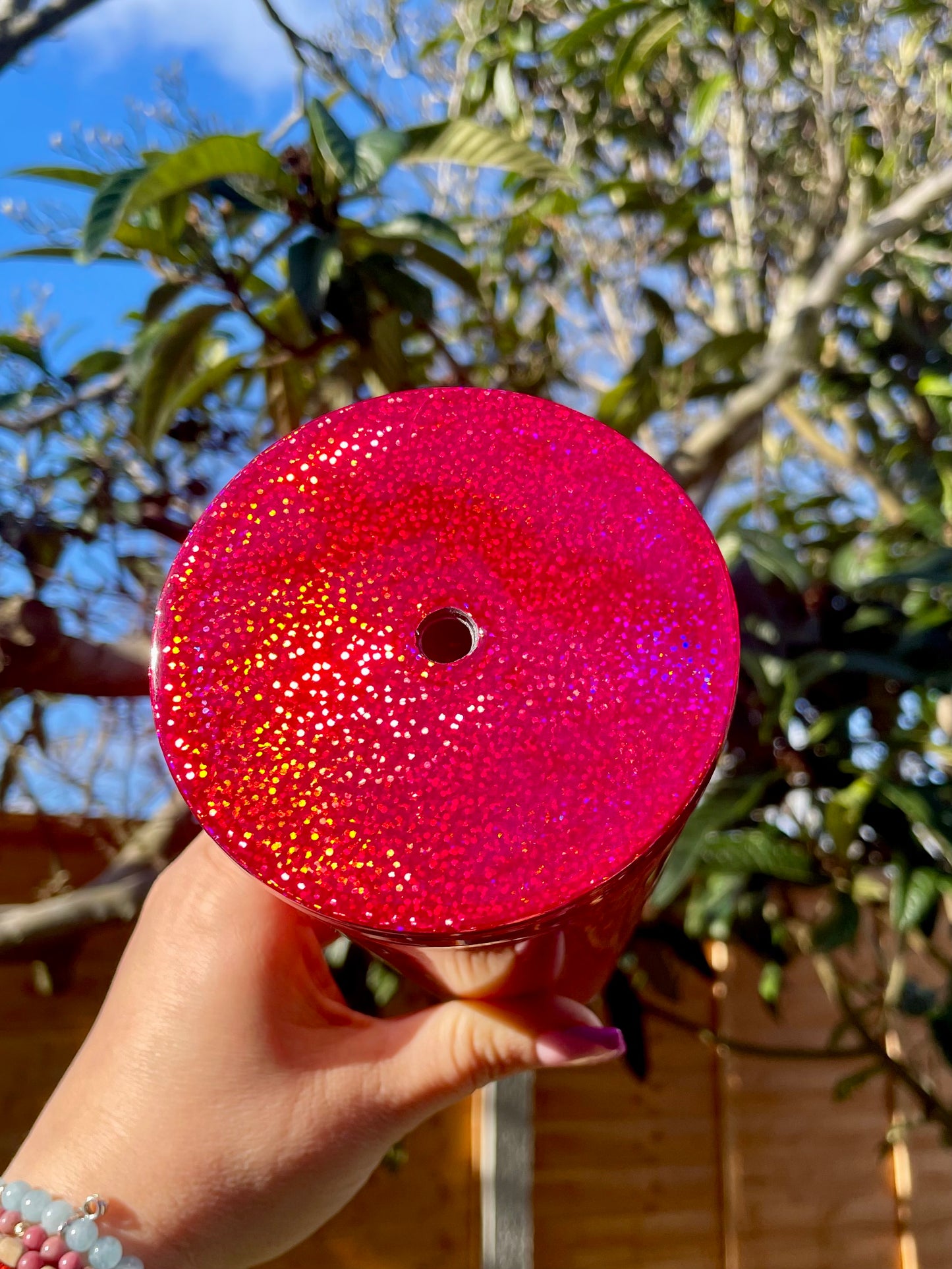 Add sparkle to your day with the Red Fire Snow Globe Tumbler! This vibrant 24oz Acrylic Snow Globe tumbler with fixed glitter features a dazzling red glitter design, perfect for keeping your drinks stylishly warm or cool. Ideal for on-the-go coffee lovers and holiday vibes. Lids decorated with permanent red vinyl and sealed.