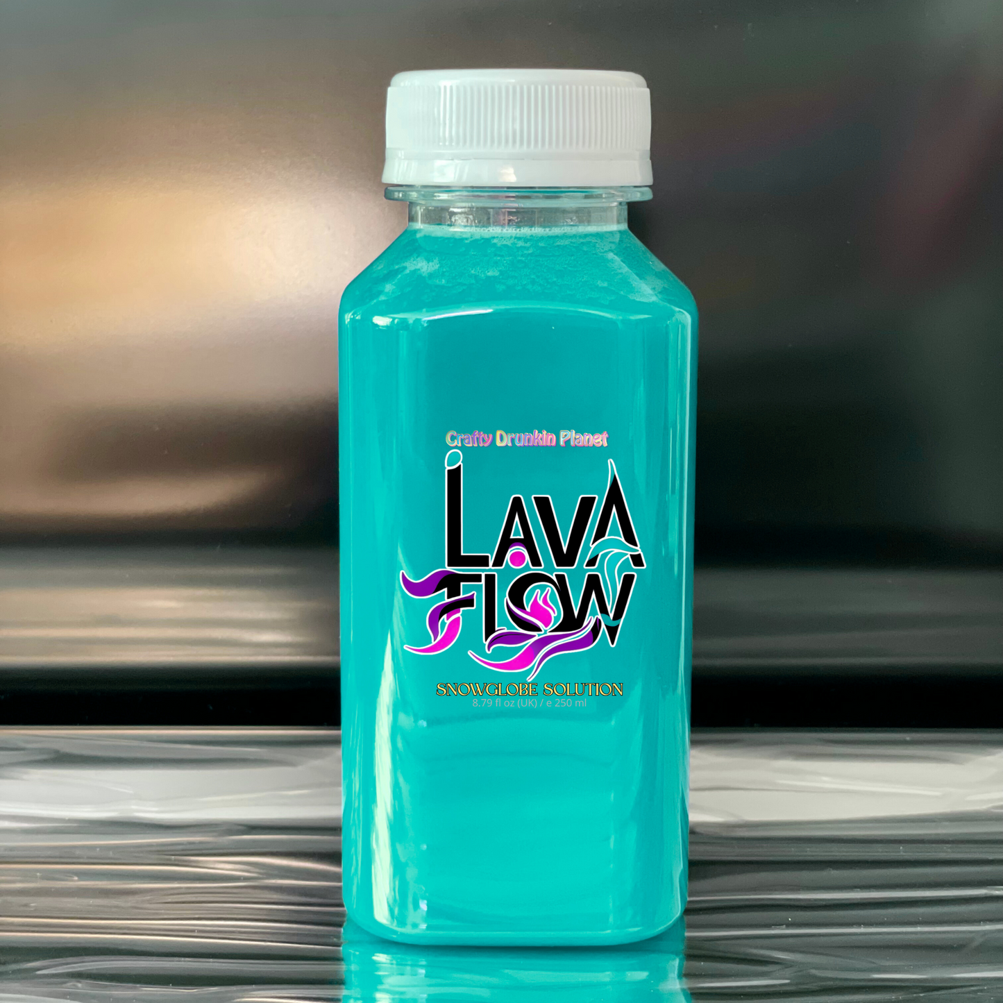 Turquoise bottle labeled 'Lava Flow' on a reflective surface with a blurred background