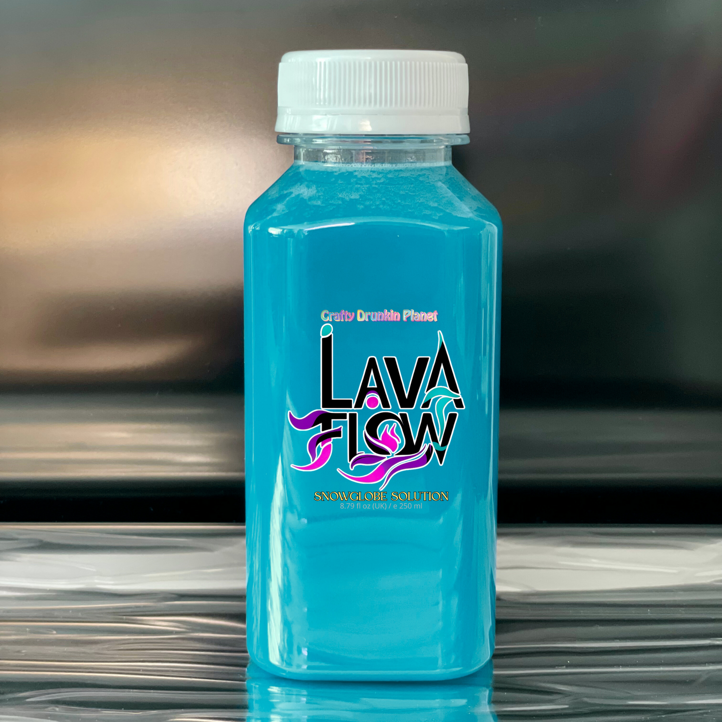 blue bottle labeled 'Lava Flow' with a white cap on a reflective surface.