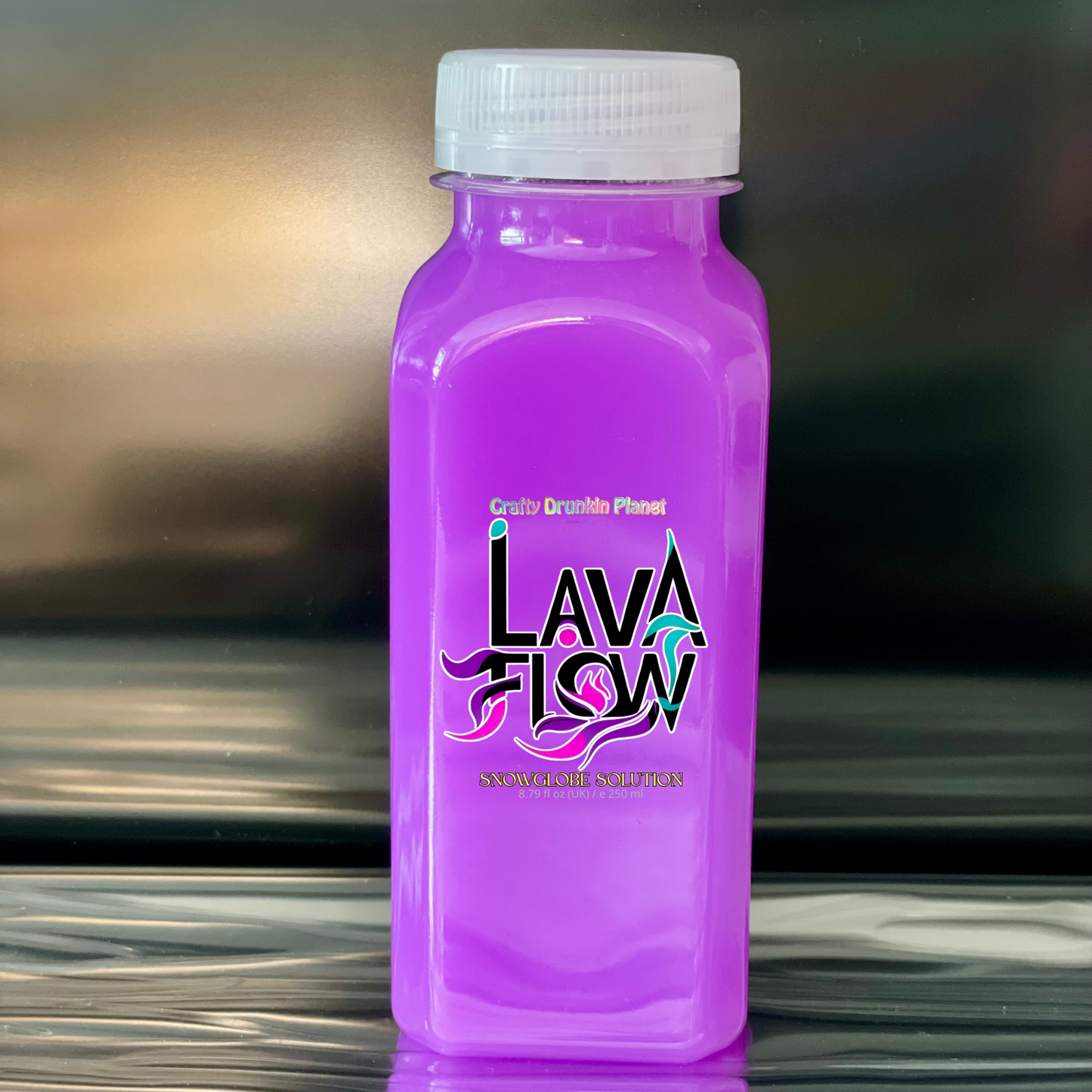 Neon Purple bottle labeled 'Lava Flow' snowglobe solution on a reflective surface with a blurred background.