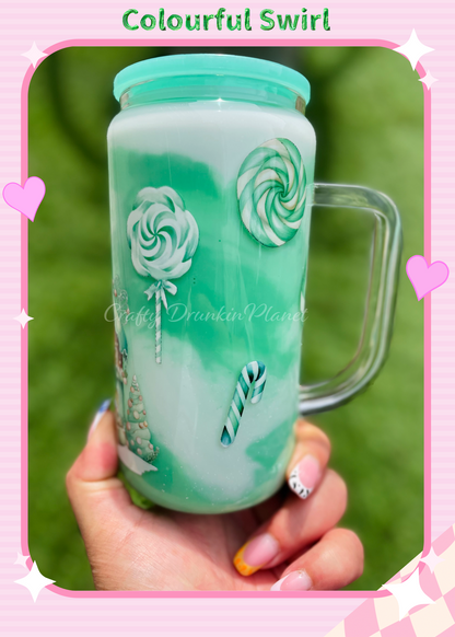Bring the festive spirit to life with this Green Christmas Milkshake Snow Globe Glass Tumbler! Featuring a whimsical gingerbread house design, vibrant green swirls, and a wintery charm, this tumbler is perfect for holiday beverages. Ideal for gifting or adding a magical touch to your Christmas celebrations