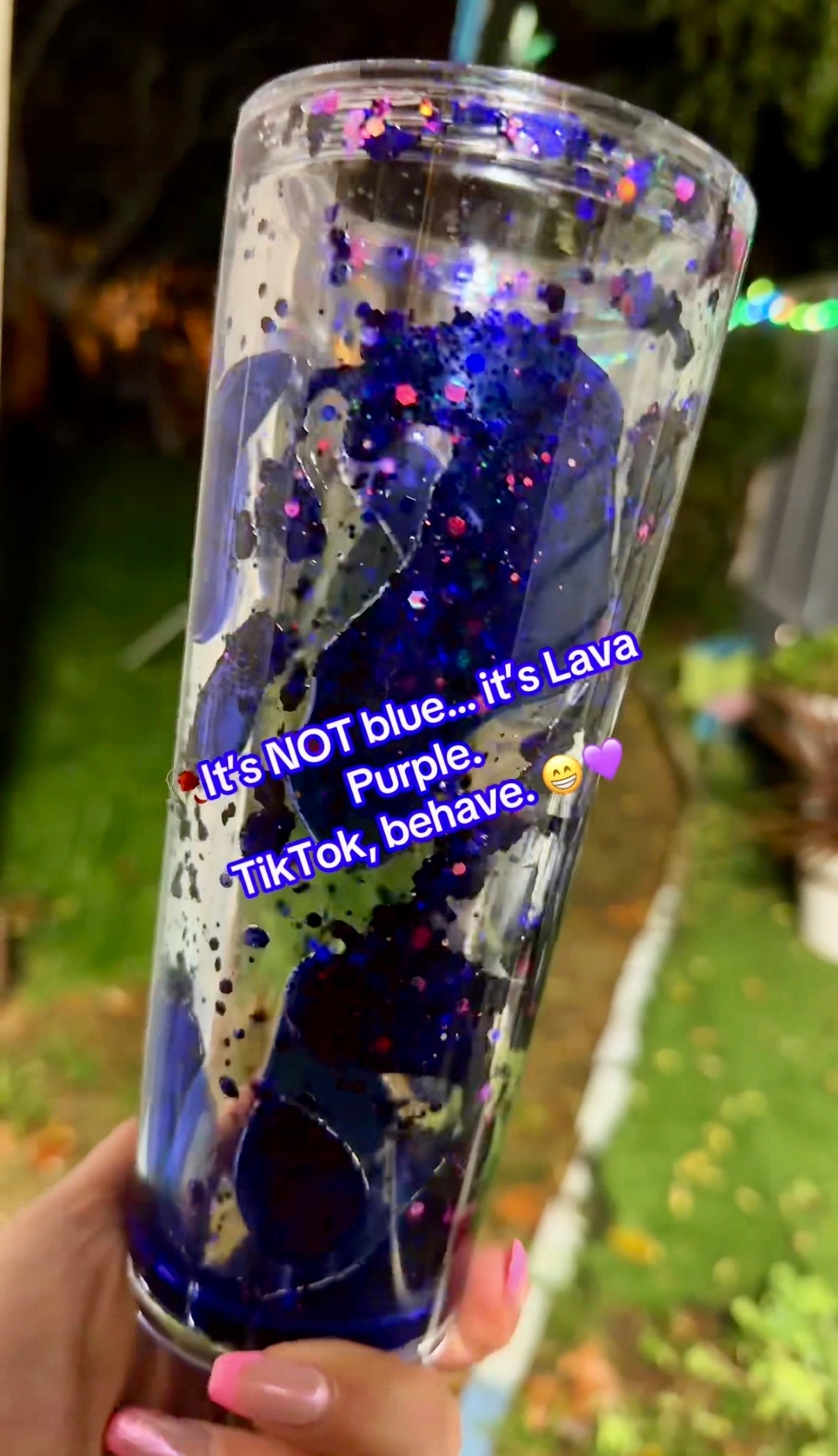 Clear tumbler with regal purple lava drip flow solution and blue gradient held by a hand, text overlay on glass.